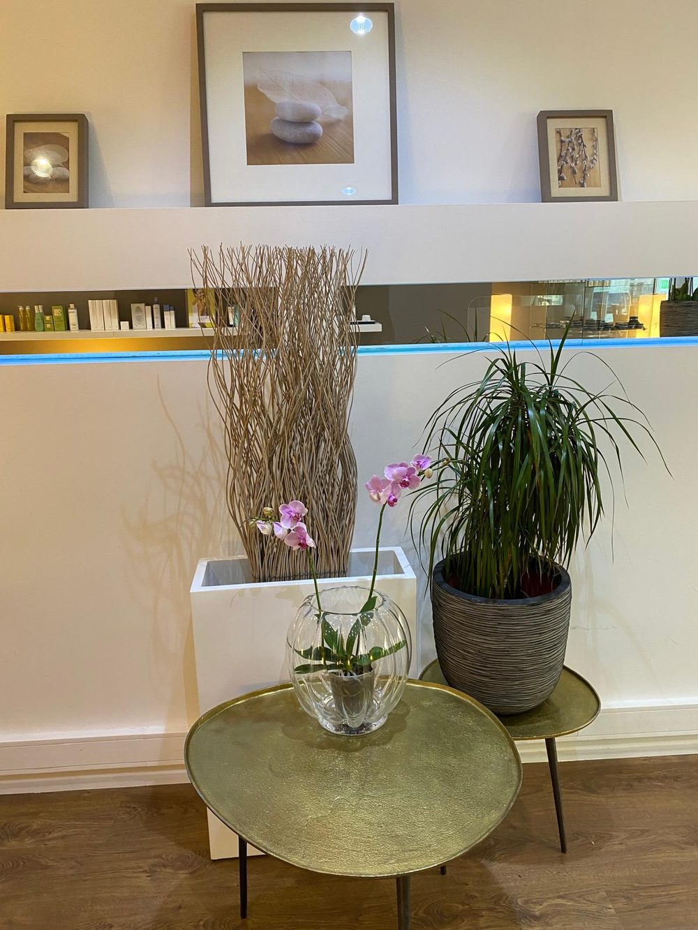Orchids on a golden side table